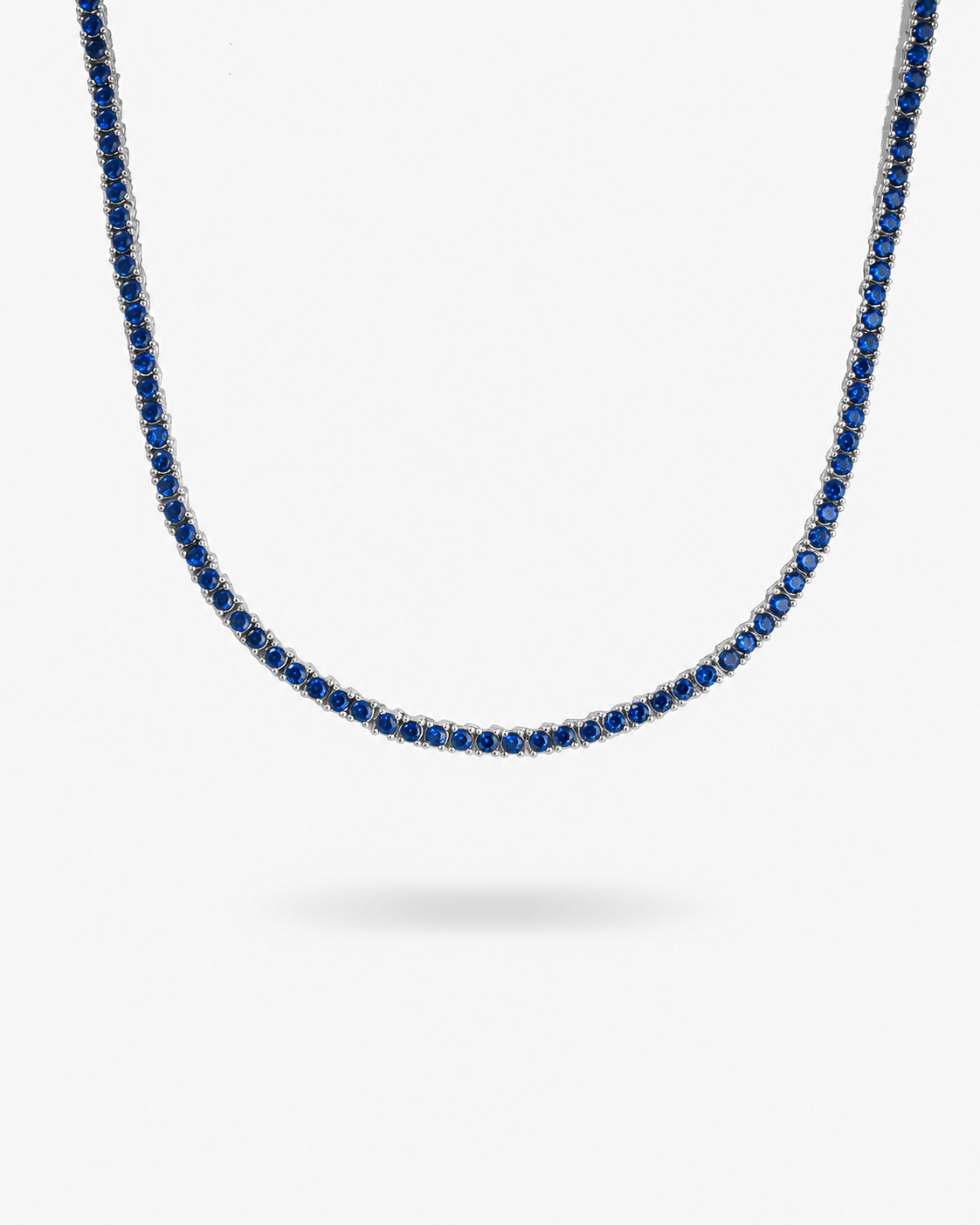 Silver tennis necklace with multicolor simulated diamond stones, alone product shot on a plain background.