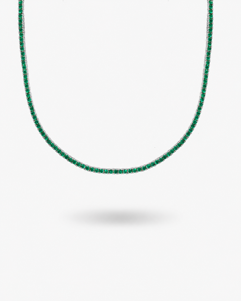 Silver tennis necklace with multicolor simulated diamond stones, alone close-up product shot from a different angle.
