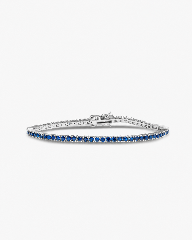 Silver tennis bracelet with multicolor simulated diamond stones, alone product shot from a different angle.