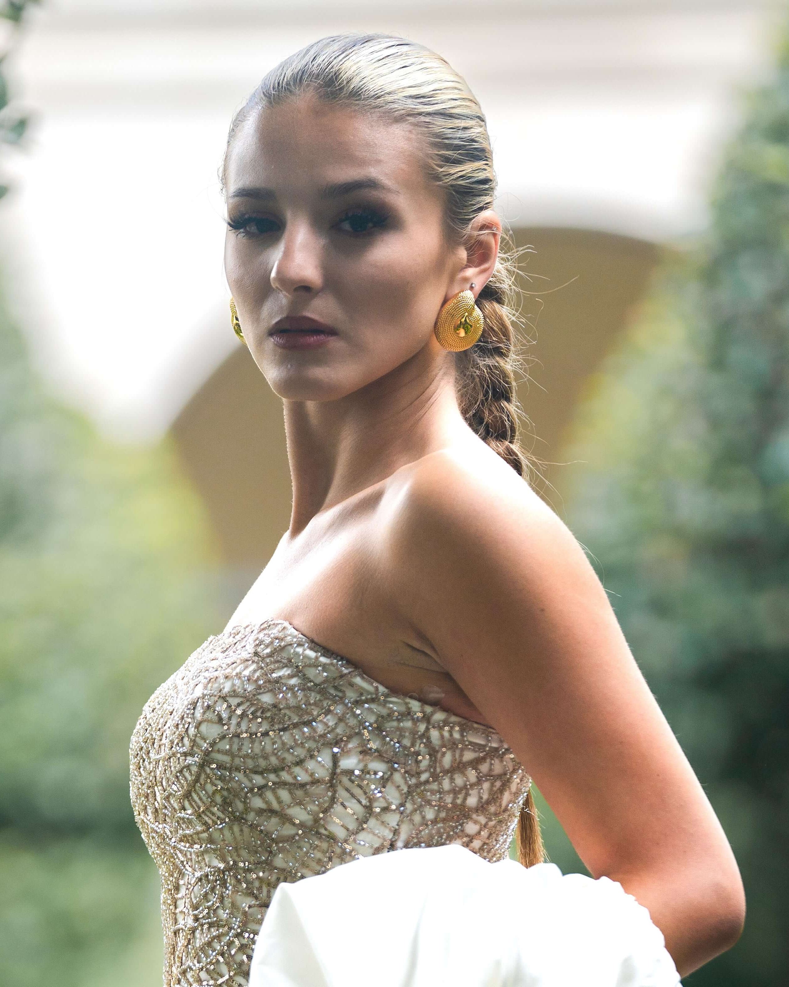 Model wearing Chiara Textured Dome Earrings