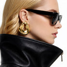 model wearing Clarice Maxi Abstract Oval Earrings