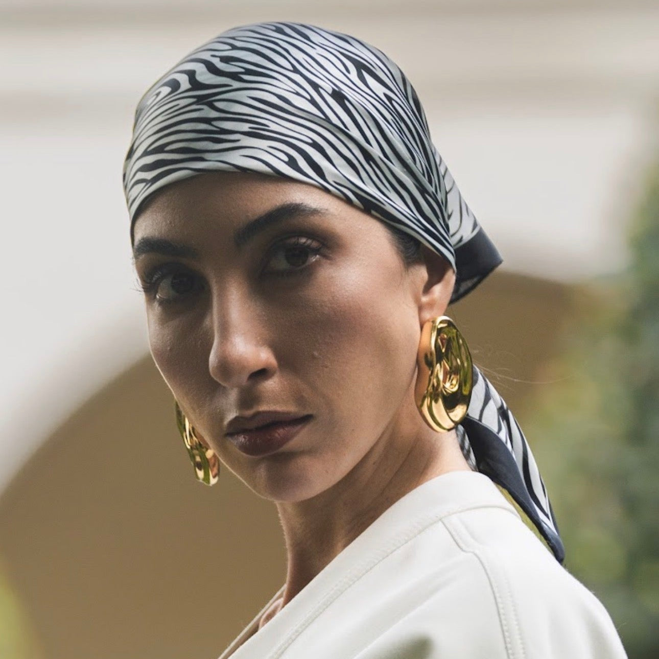 model wearing Clarice Maxi Abstract Oval Earrings