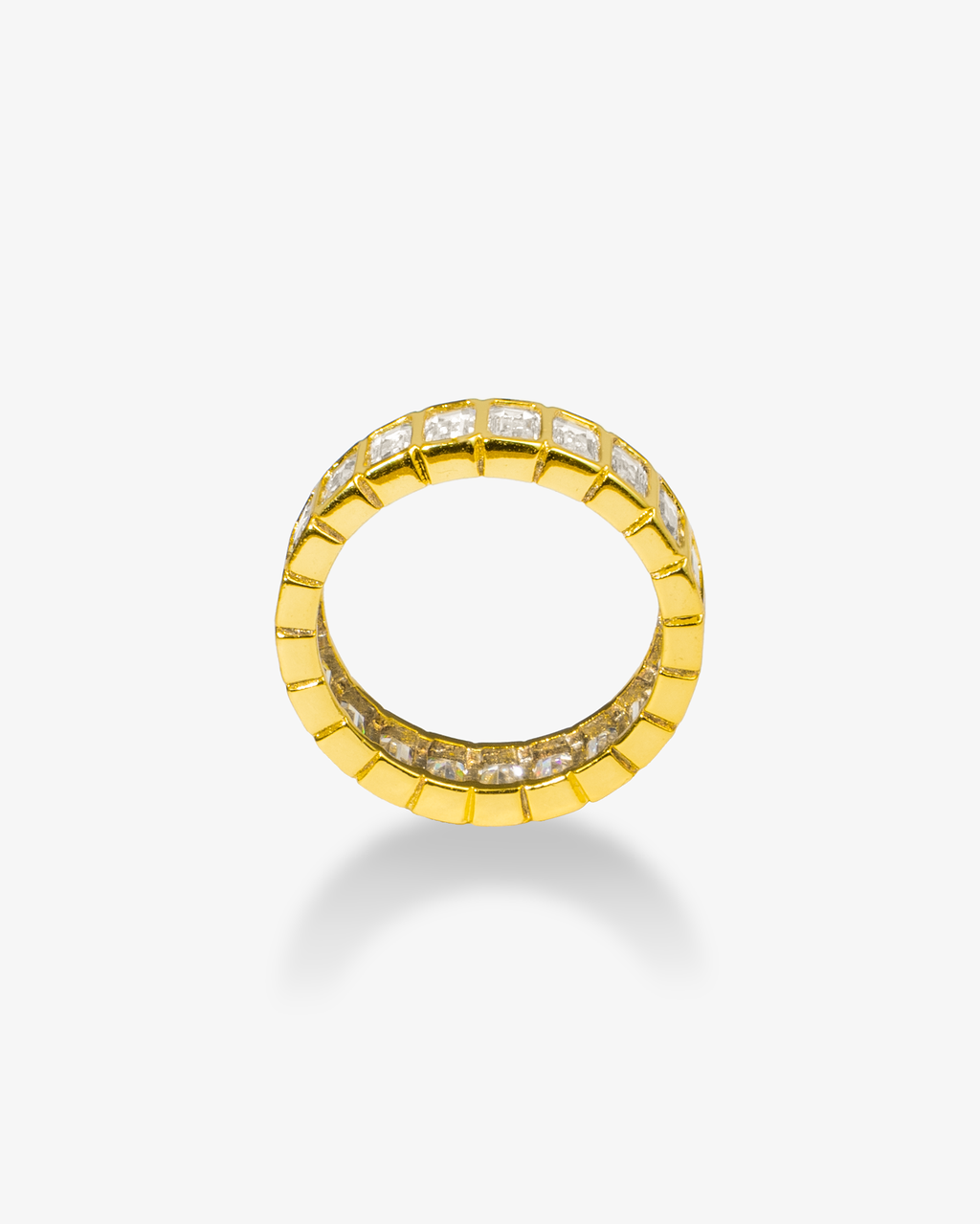 Gold baguette simulated diamond eternity ring, alone close-up product shot from a circular angle.