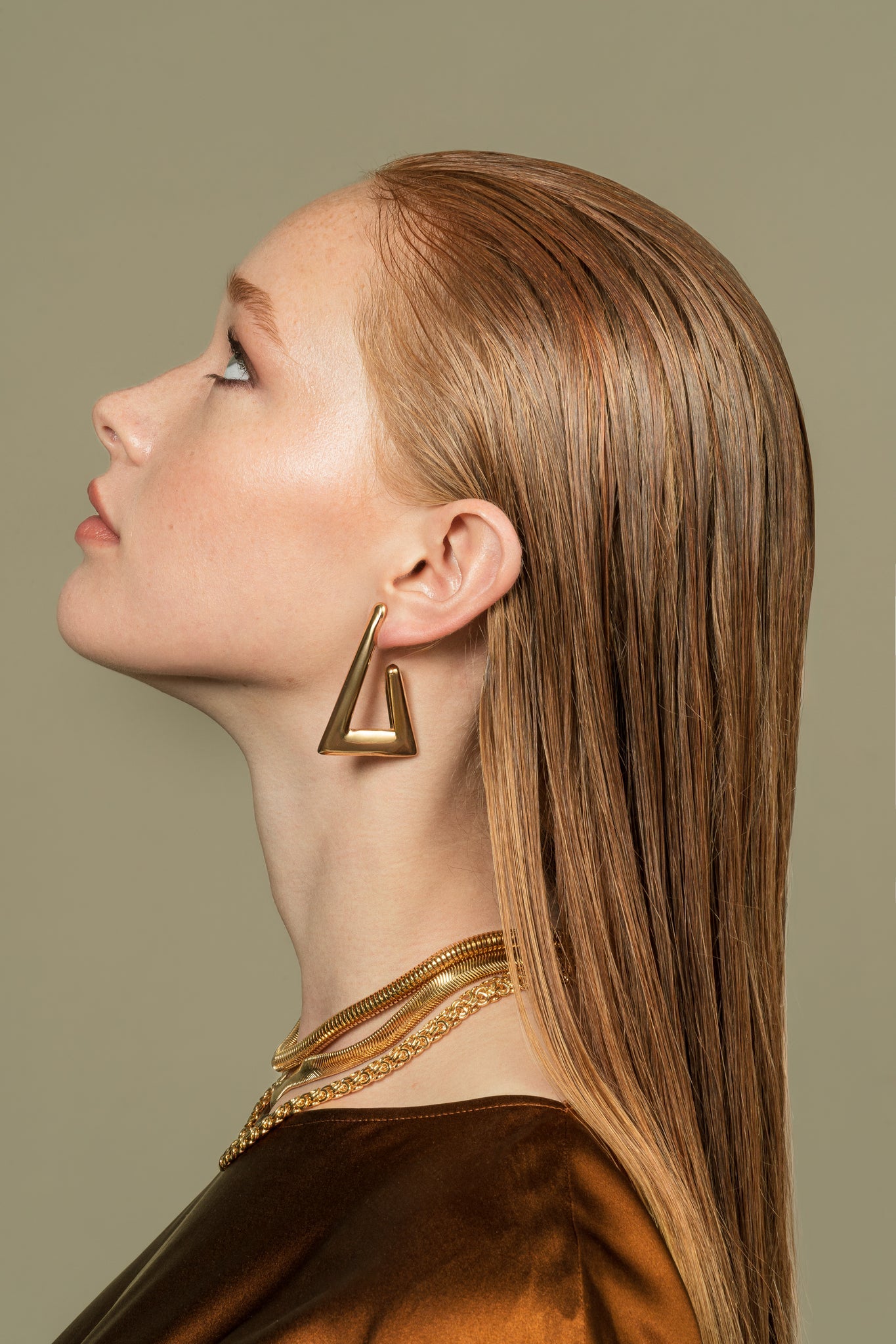 Geometric gold and rhodium plated triangular earrings with open-frame design and high-polish finish, 34mm by 50mm size