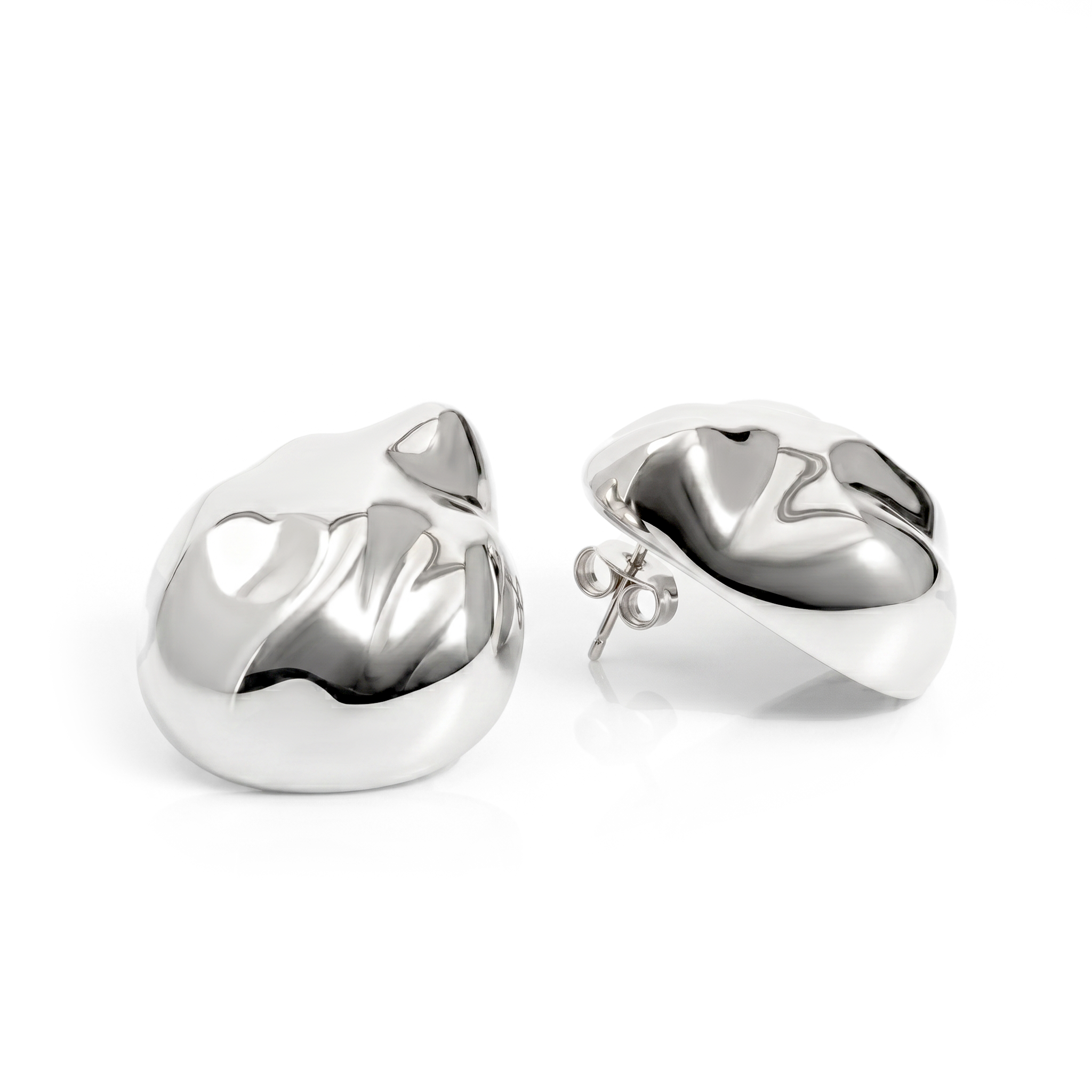 Dome earrings available in gold plated and rhodium plated finishes with dented sculptural texture