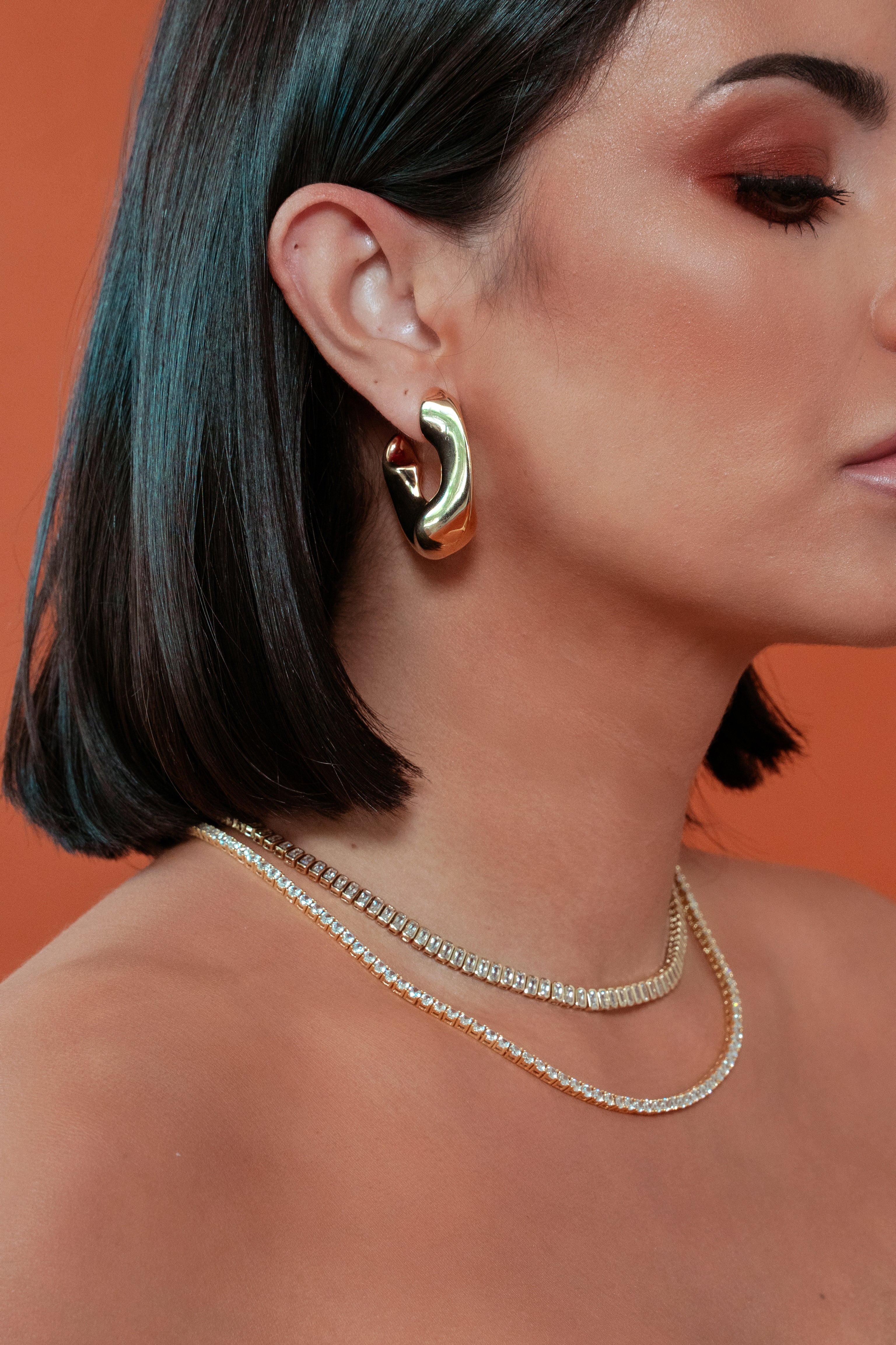 model wearing Ana Gold Hoops