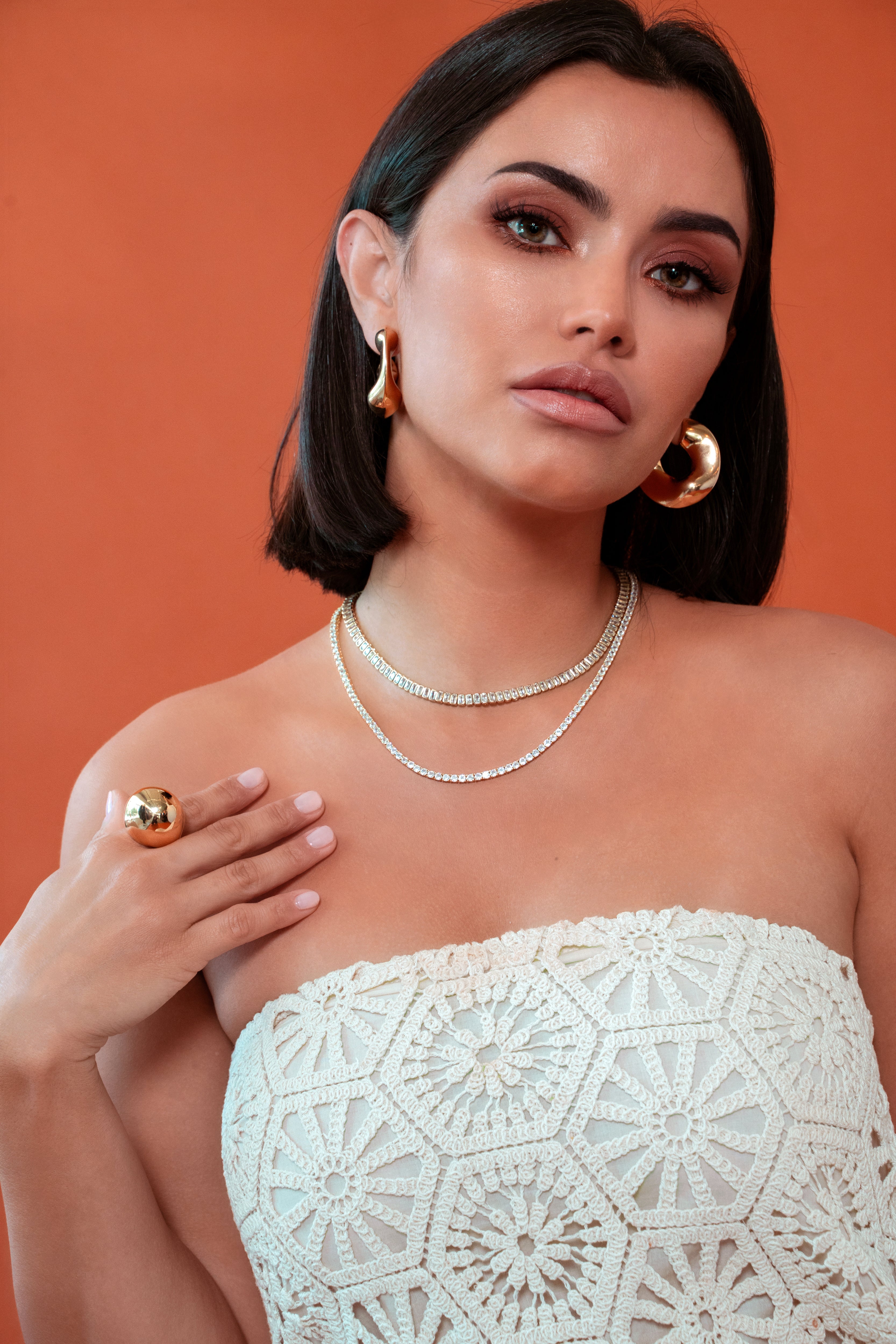 Sculptural statement ring in gold dome style, crafted with shiny 18K gold plating for modern elegance.