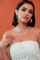 Sculptural statement ring in gold dome style, crafted with shiny 18K gold plating for modern elegance.