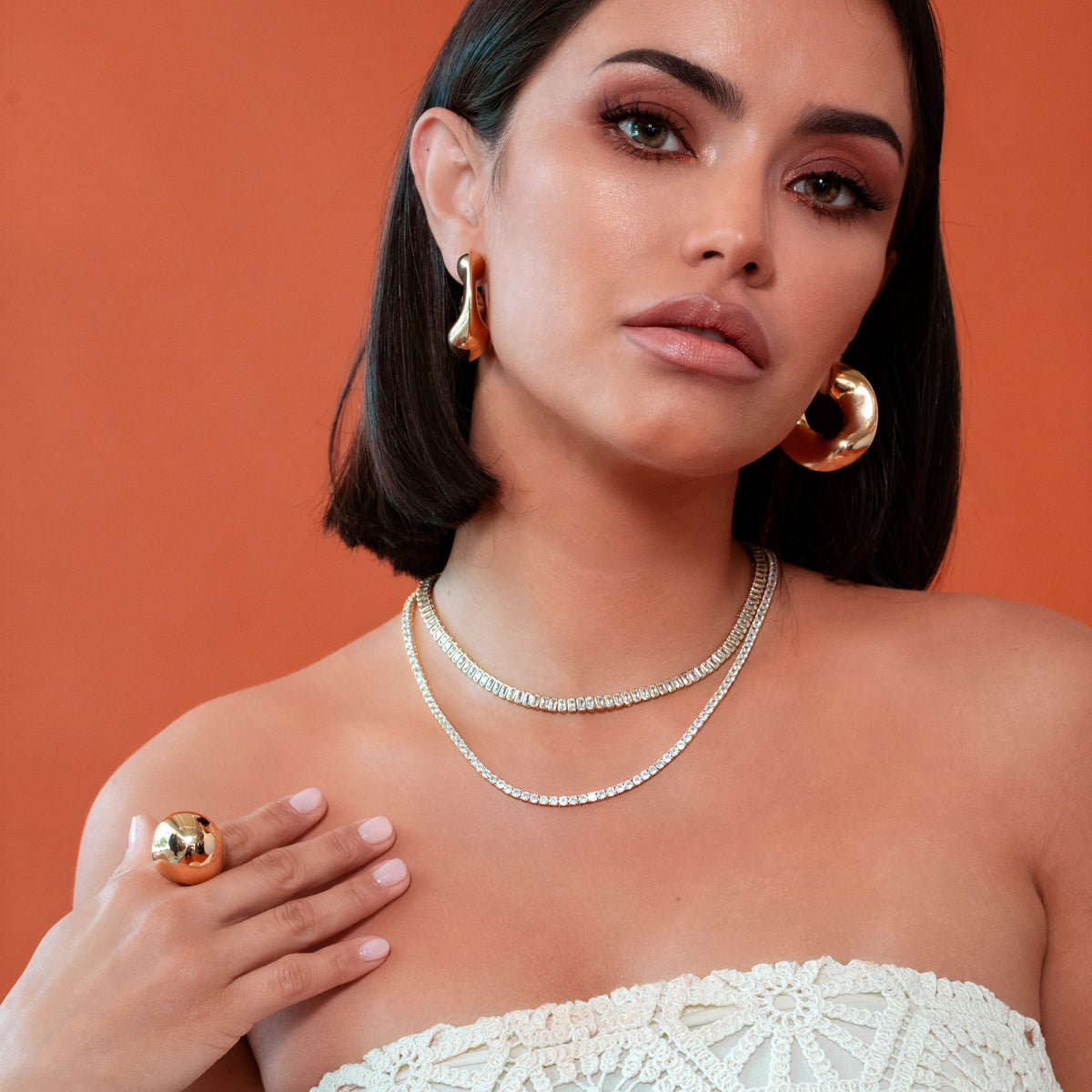 Sculptural statement ring in gold dome style, crafted with shiny 18K gold plating for modern elegance.