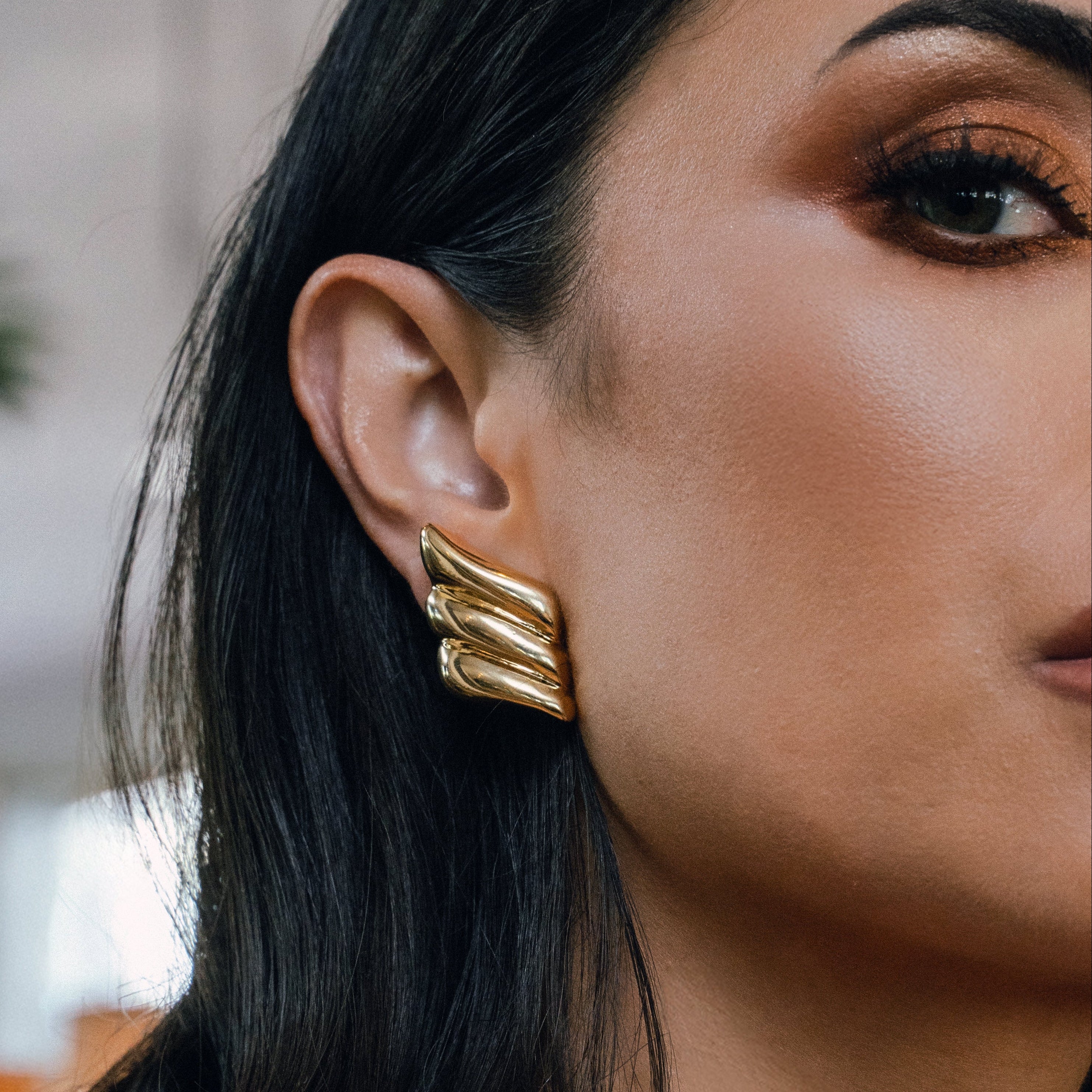 model wearing Amelie Gold Earrings