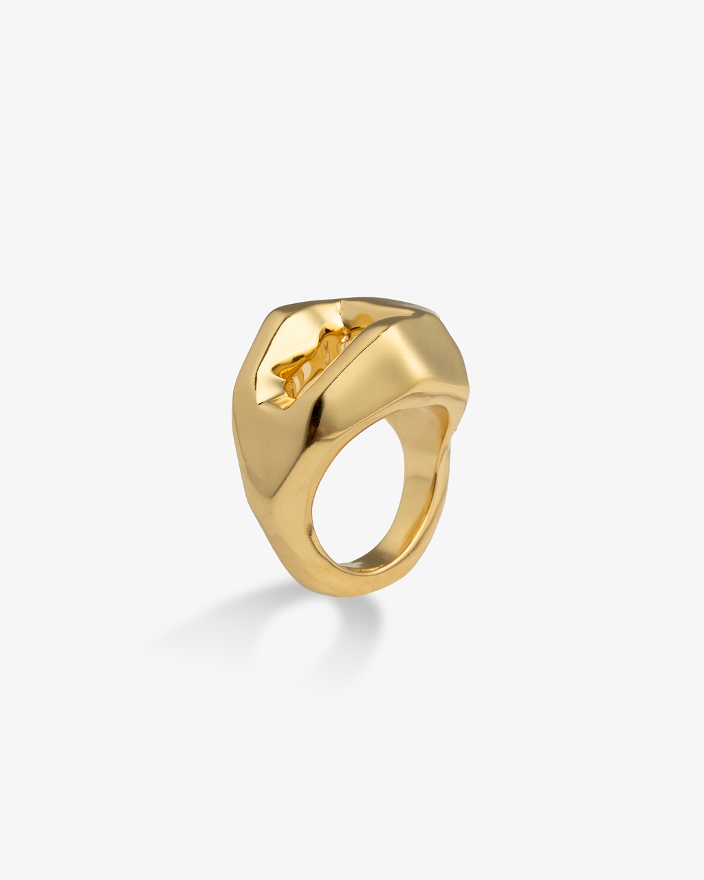 Gold chunky geometric faceted ring, alone product shot on a plain background.