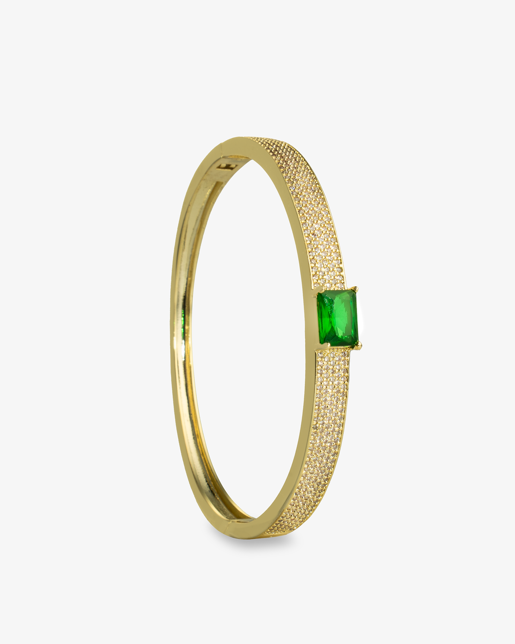 Gold open cuff bangle bracelet with a single green simulated diamond stone, alone product shot shown vertically.
