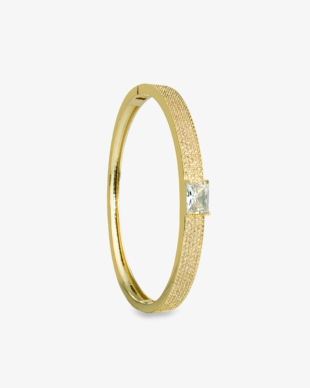 Gold open cuff bangle bracelet with a single clear simulated diamond stone, alone product shot shown vertically.