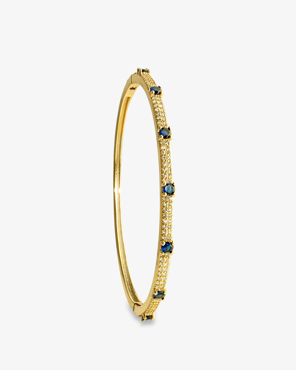 Gold thin bangle bracelet with colored stone detailing, alone product shot from a different angle.