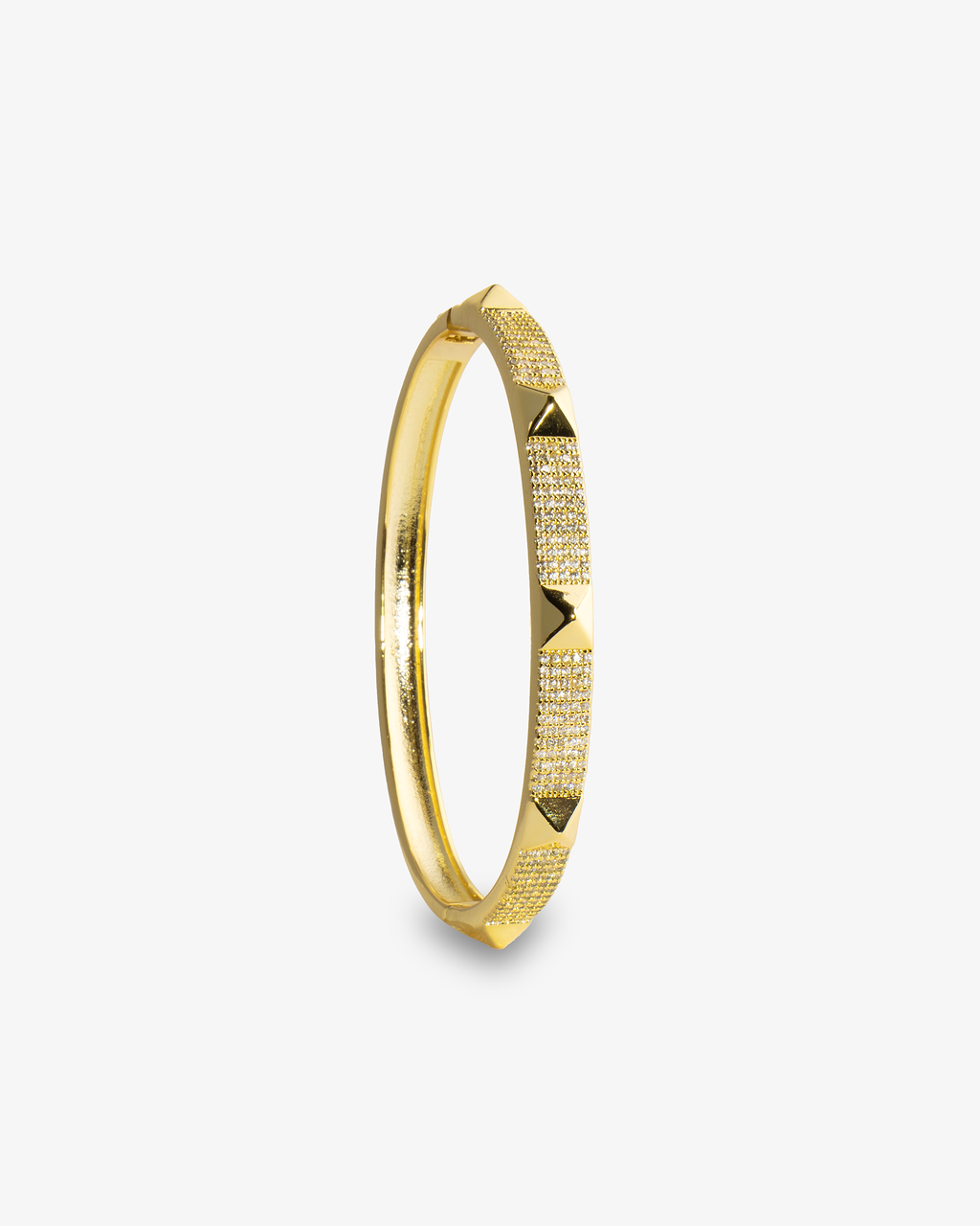 Gold textured bangle bracelet, close-up alone shot highlighting the notched texture.