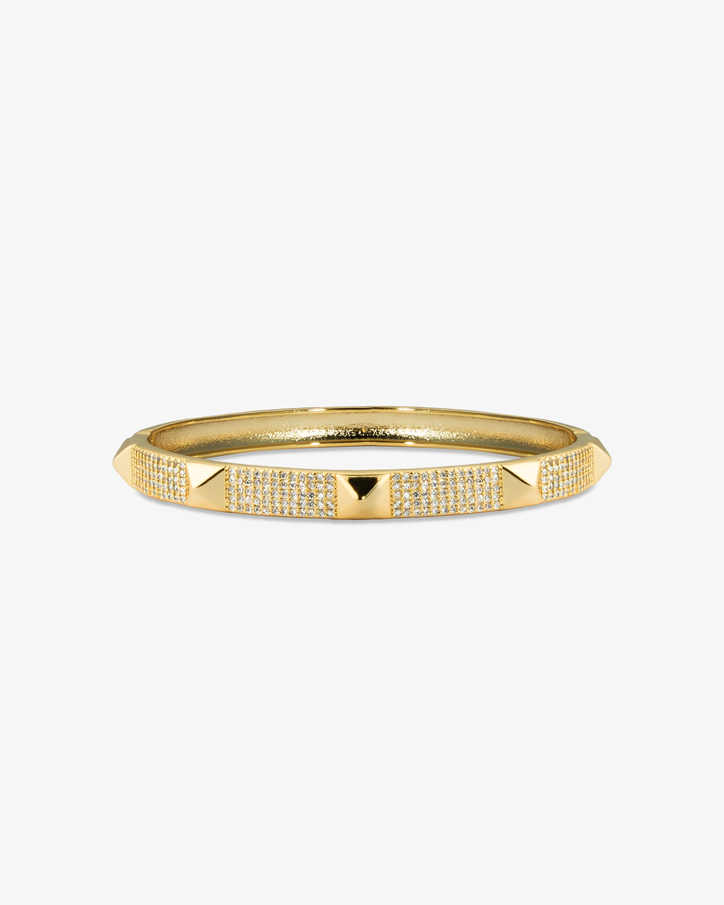 Gold textured bangle bracelet, alone product shot on a plain background.