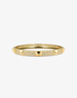Gold textured bangle bracelet, alone product shot on a plain background.
