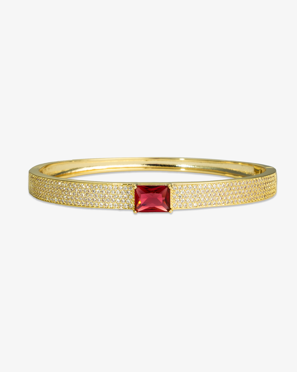 Silver pave bangle bracelet with a single green simulated diamond stone, alone product shot on a plain background.