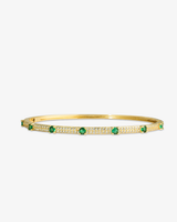 Gold thin bangle bracelet with green simulated diamond stone detailing, alone product shot on a plain background.