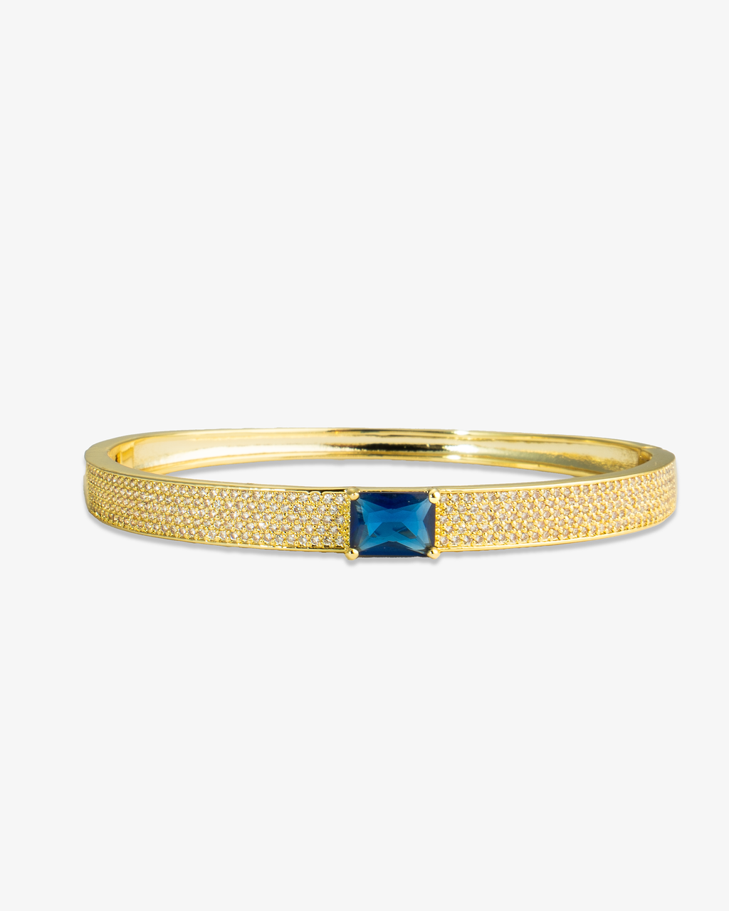 Silver pave bangle bracelet with a single red simulated diamond stone, alone product shot on a plain background.