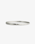 Silver slim textured bangle bracelet, alone product shot on a plain background.
