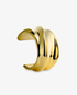 Gold wide sculptural statement cuff bracelet, alone product shot on a plain background.