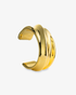 Gold chunky sculptural wave cuff bracelet, alone product shot on a plain background.