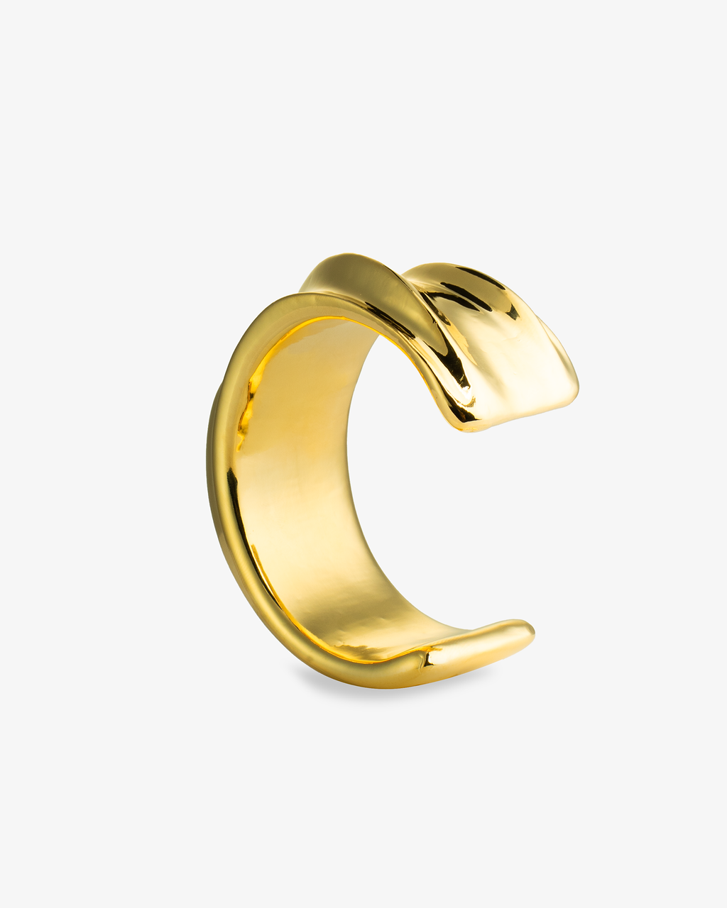 Gold chunky sculptural wave cuff bracelet, alone product shot from a third angle.