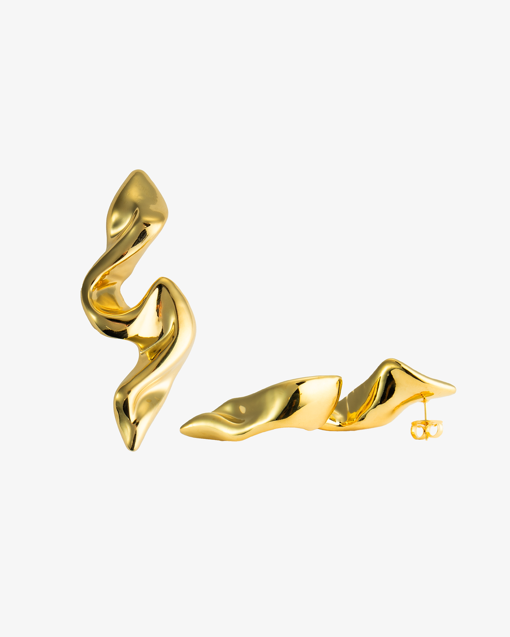 Gold organic sculptural spiral statement drop earring, alone close-up product shot laid on its side.