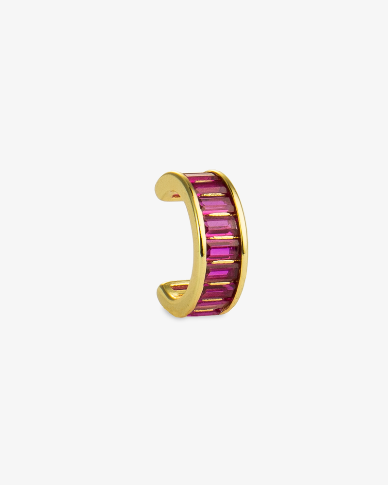 Gold ear cuff with pink baguette-cut simulated diamond stones, alone product shot on a plain background.