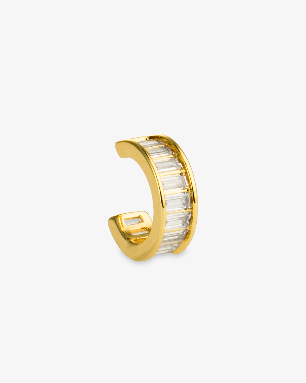 Gold ear cuff with clear baguette-cut simulated diamond stones, alone product shot on a plain background.