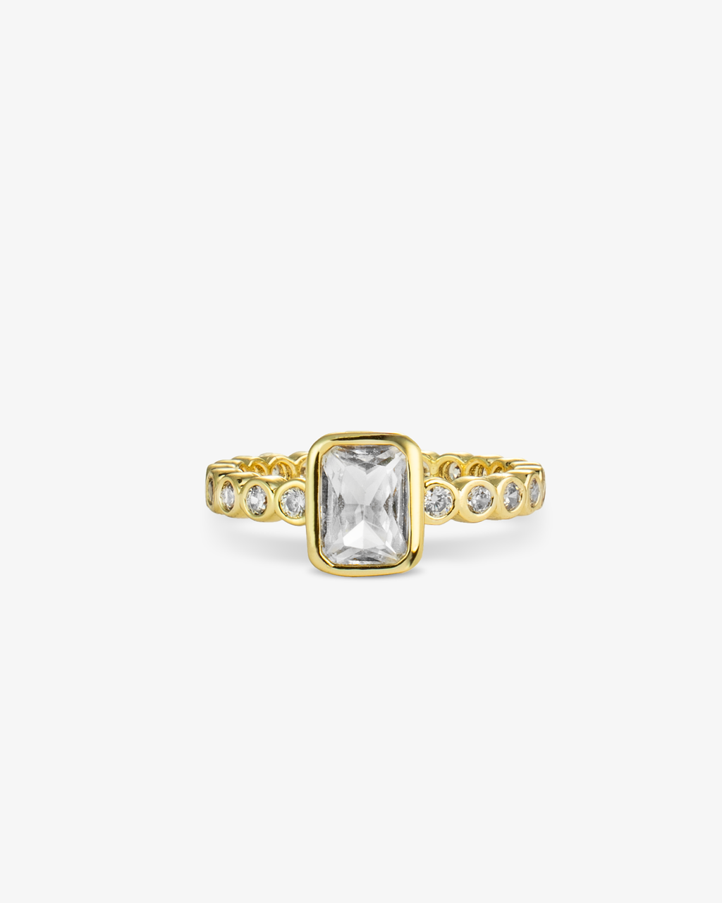 Gold ring with a clear emerald-cut simulated diamond center stone and pave band, alone product shot on a plain background.