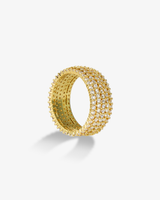 Gold chunky pave simulated diamond band ring, alone product shot on a plain background.