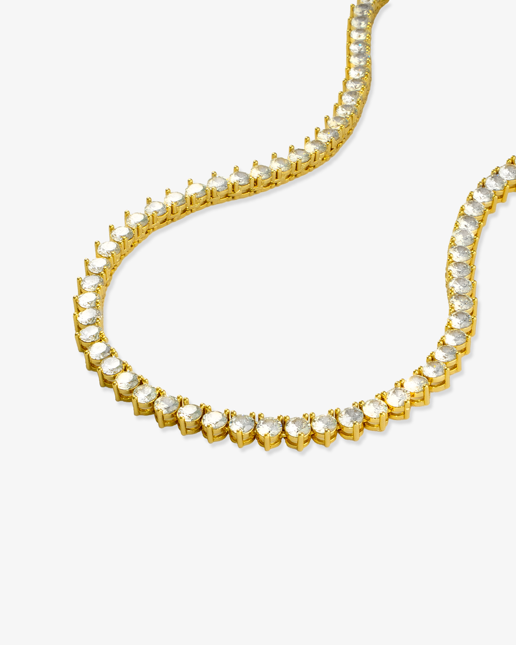 Gold round simulated diamond tennis necklace, alone product shot laid in a curved squiggle shape.