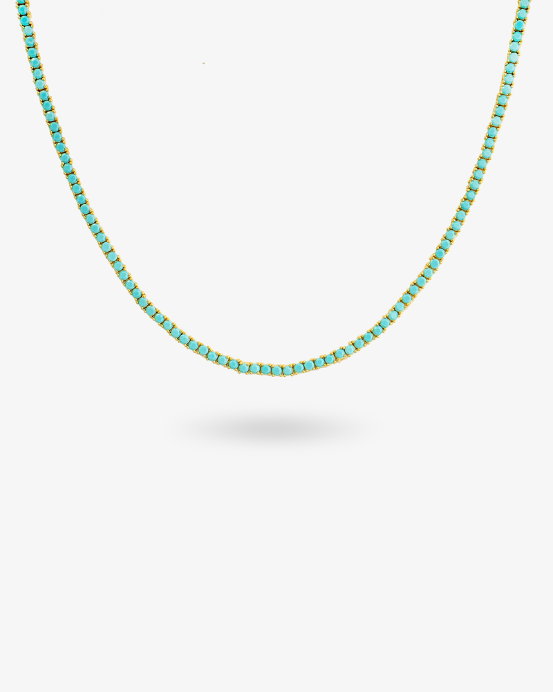Gold tennis necklace with multicolor simulated diamond stones, alone product shot from a different angle.