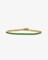 Gold tennis bracelet with multicolor simulated diamond stones, alone product shot on a plain background.
