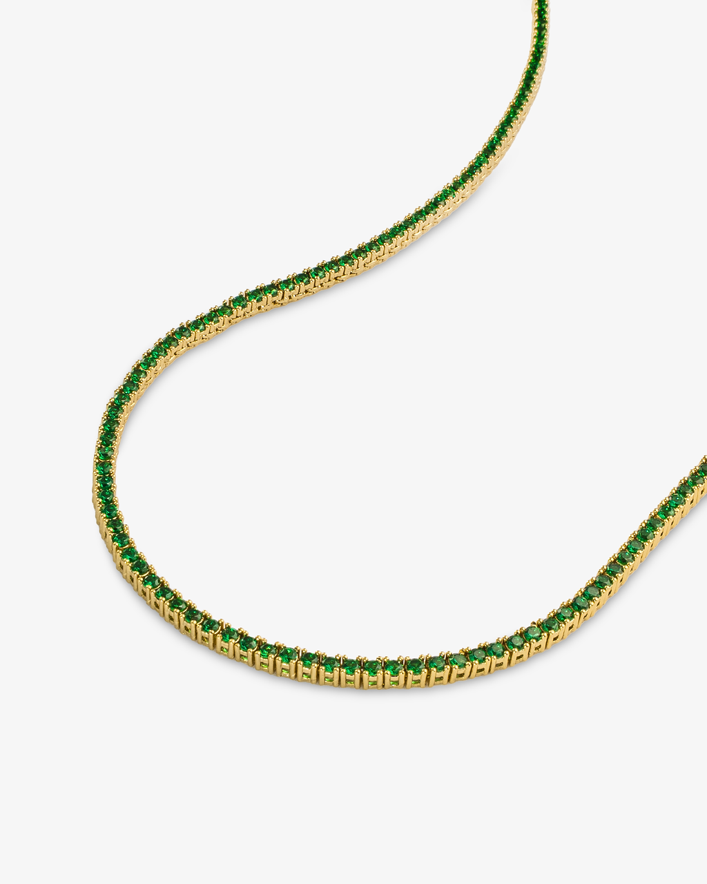 Gold tennis necklace with multicolor simulated diamond stones, alone close-up product shot.