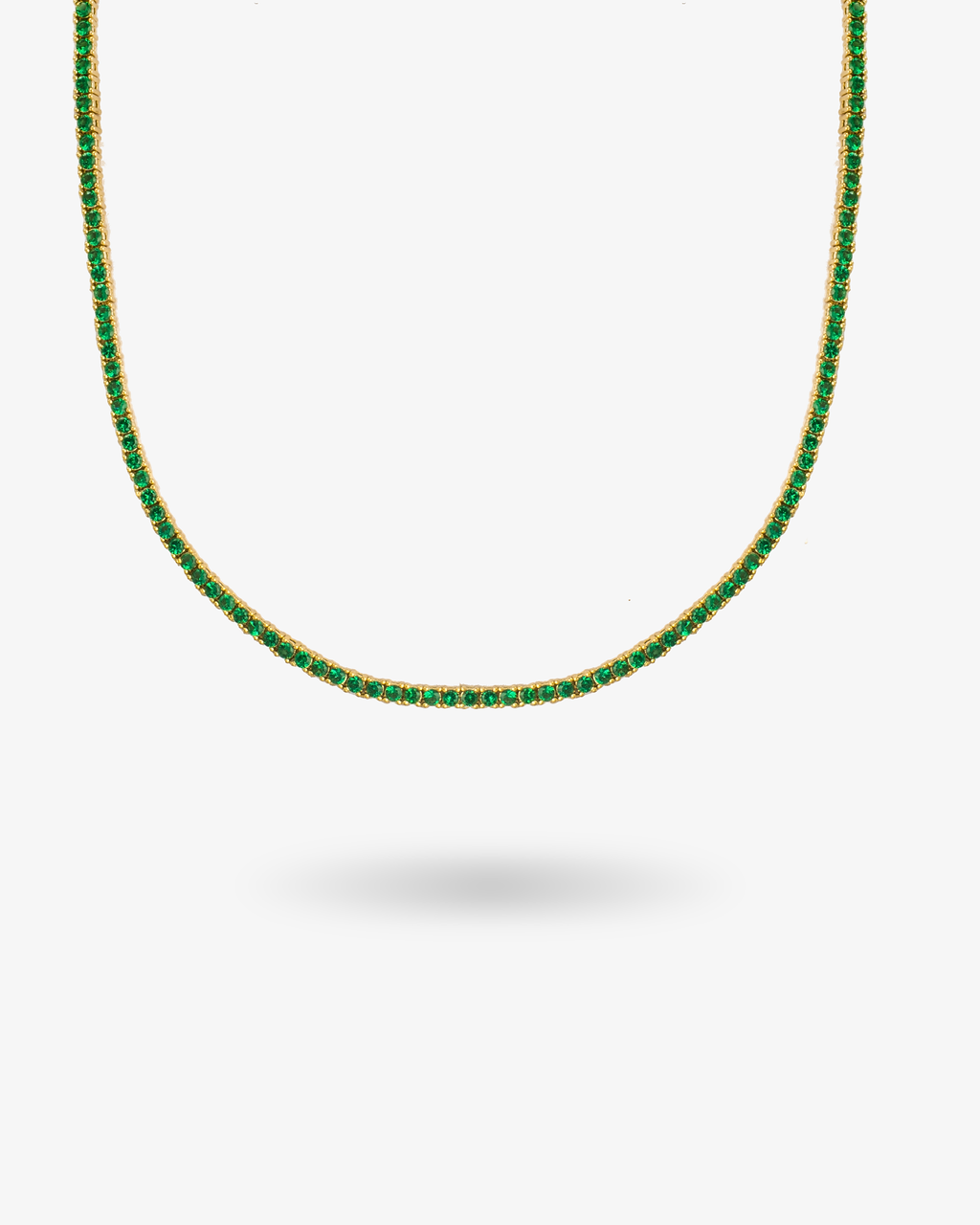 Gold tennis necklace with multicolor simulated diamond stones, alone product shot on a plain background.