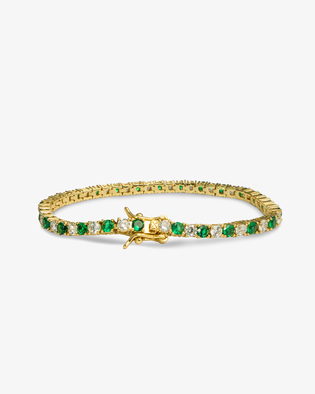 Gold tennis bracelet with green colored stone detailing, alone product shot from a different angle.
