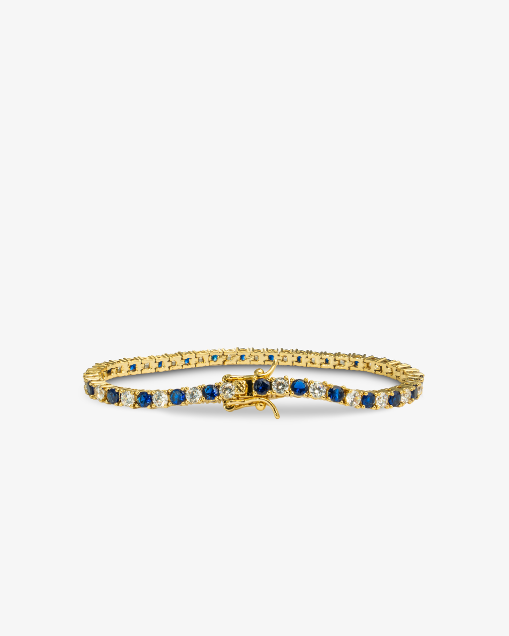 Gold tennis bracelet with blue colored stone detailing, alone product shot from a different angle.