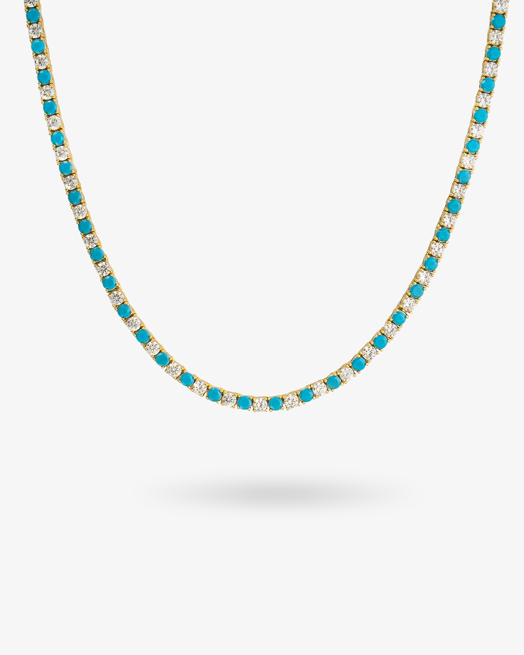Tennis necklace with turquoise-colored simulated diamond stones, alone product shot on a plain background.