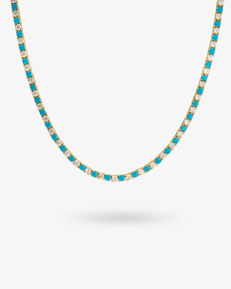 Tennis necklace with turquoise-colored simulated diamond stones, alone product shot on a plain background.
