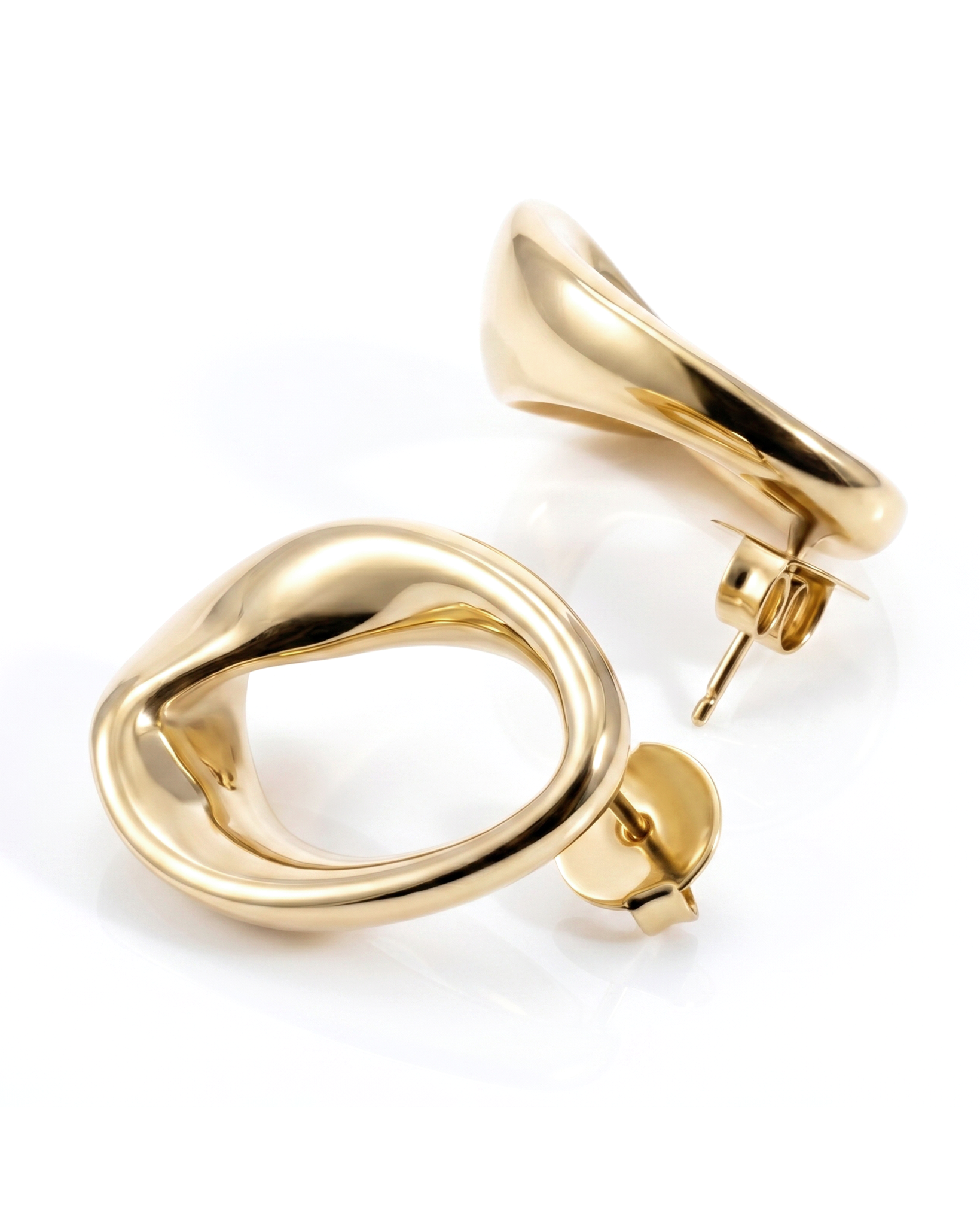 Abstract oval earrings available in gold plated and rhodium plated finishes with sculptural geometric design
