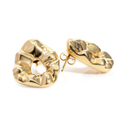 Sculptural hammered earrings available in gold plated and rhodium plated finishes with organic texture