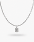 Silver tennis necklace with a pave simulated diamond initial letter pendant, alone product shot on a plain background.