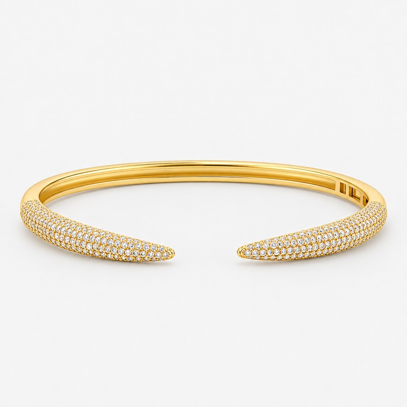 Gold pavé simulated diamond open cuff bangle bracelet, alone product shot on a plain background.