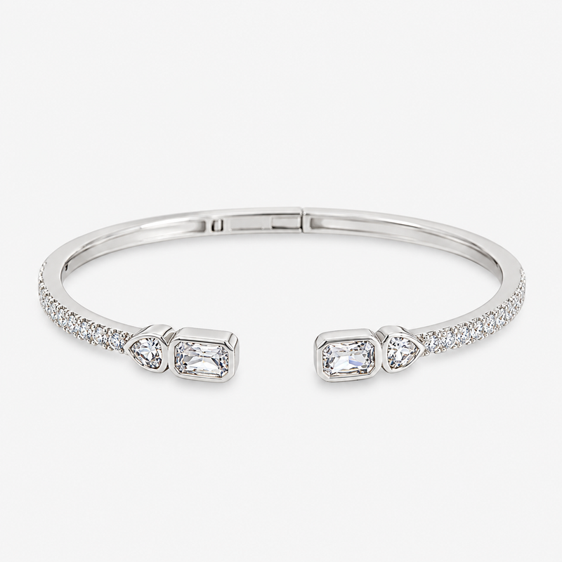 Silver open bangle bracelet with pavé simulated diamond accents at each end, alone product shot on a plain background.