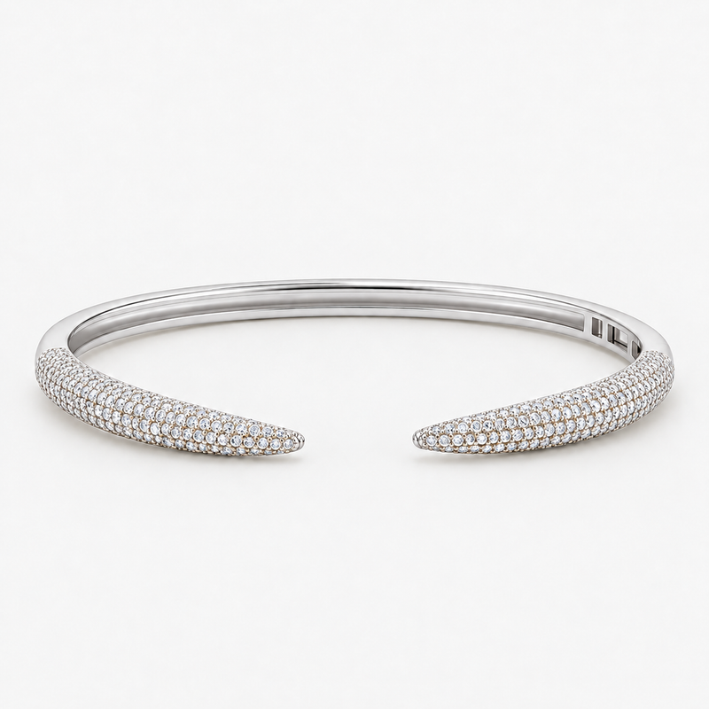 Silver pavé simulated diamond open cuff bangle bracelet, alone product shot on a plain background.