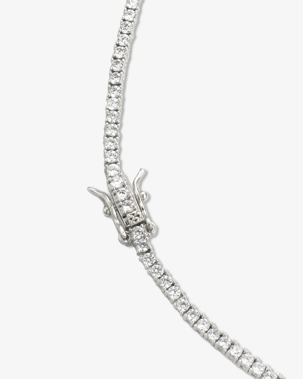 Silver tennis choker necklace close-up showing stone setting and clasp