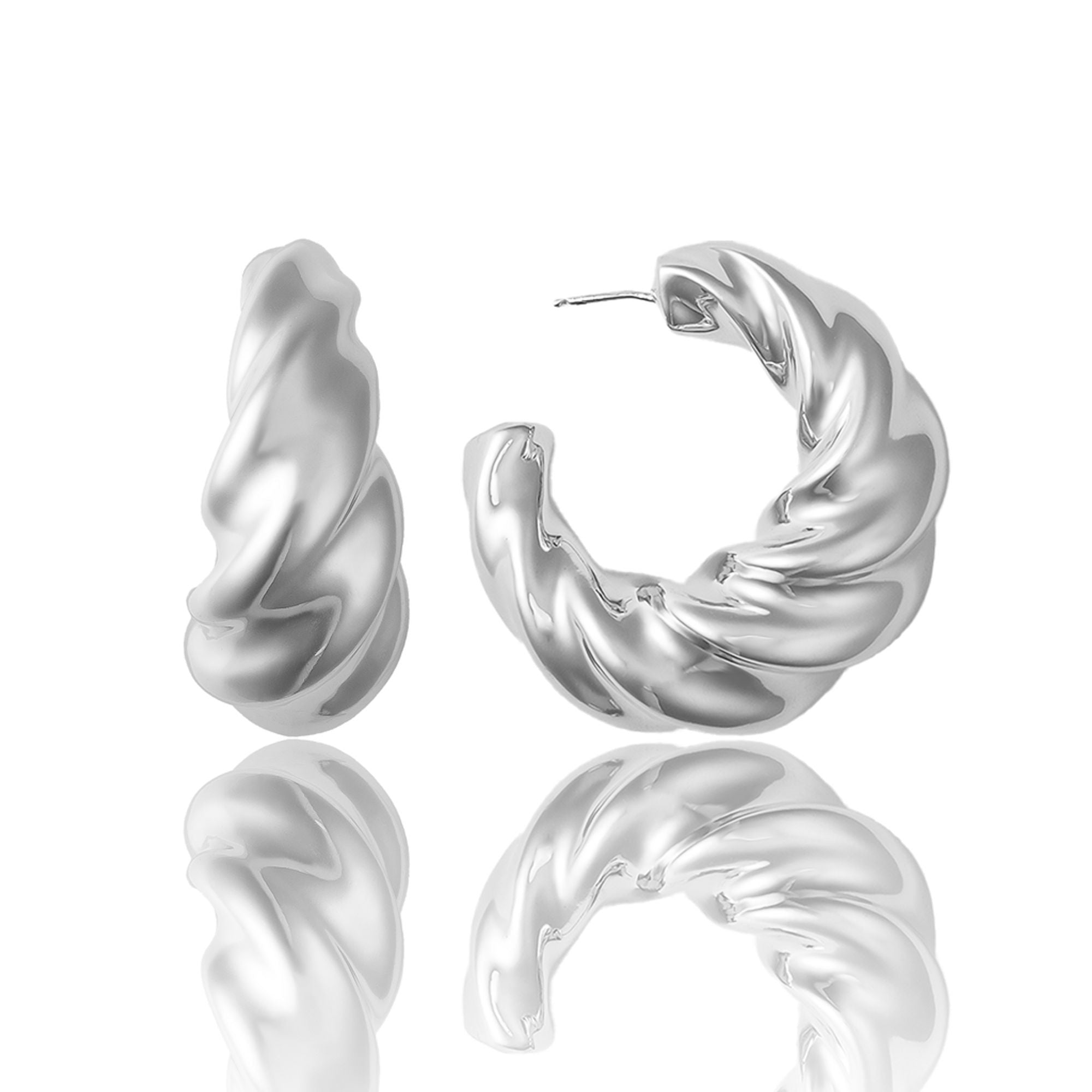 Rhodium plated bold hoop earrings with thick sculptural profile and polished finish
